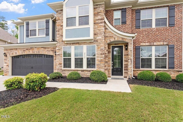 2333 Lantern Walk Ln, Wake Forest, NC 27587 - view of property featuring stone siding, an attached garage, concrete driveway, and a front yard