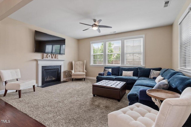 2333 Lantern Walk Ln, Wake Forest, NC 27587 - living area with baseboards, a ceiling fan, and a fireplace with flush hearth