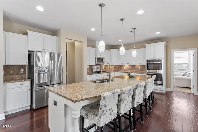 2333 Lantern Walk Ln, Wake Forest, NC 27587 - kitchen featuring stainless steel appliances, a sink, backsplash, white cabinets, and recessed lighting