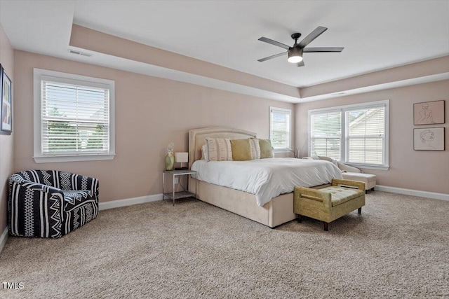2333 Lantern Walk Ln, Wake Forest, NC 27587 - carpeted bedroom with baseboards, a tray ceiling, and a ceiling fan