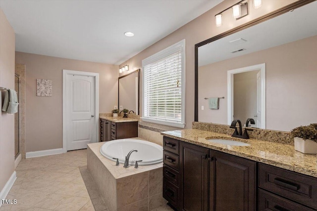 2333 Lantern Walk Ln, Wake Forest, NC 27587 - full bathroom with a bath, a shower stall, two vanities, baseboards, and tile patterned floors