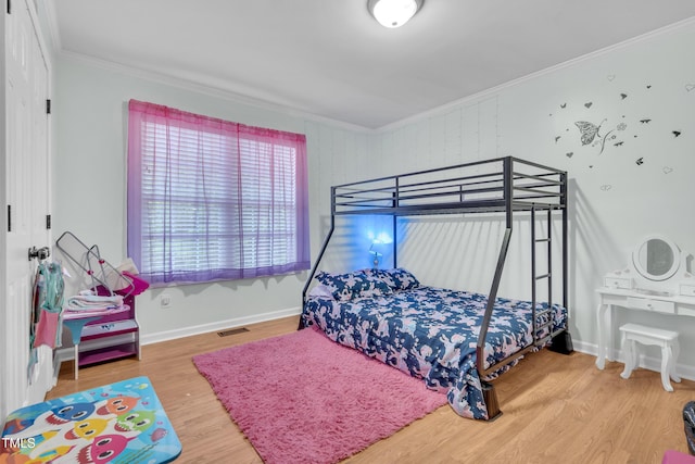 144 Shawnee Dr, Louisburg, NC 27549 - bedroom with crown molding, wood finished floors, and baseboards
