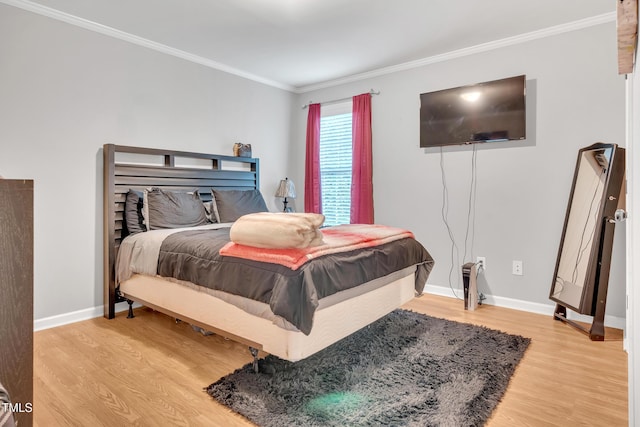 144 Shawnee Dr, Louisburg, NC 27549 - bedroom with light wood-type flooring, crown molding, and baseboards