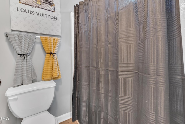 144 Shawnee Dr, Louisburg, NC 27549 - full bathroom with toilet, baseboards, and a shower with shower curtain