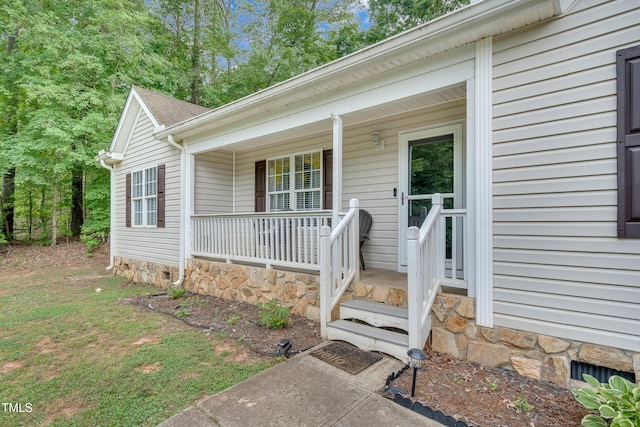 144 Shawnee Dr, Louisburg, NC 27549 - doorway to property with covered porch