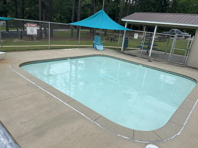 144 Shawnee Dr, Louisburg, NC 27549 - community pool featuring a patio area