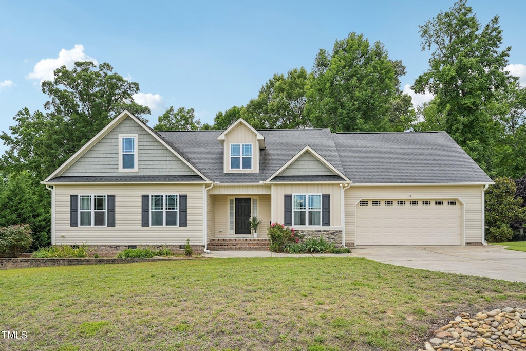 33 Bluestone Dr, Smithfield, NC 27577 - craftsman-style house featuring a garage, driveway, a front yard, and a shingled roof