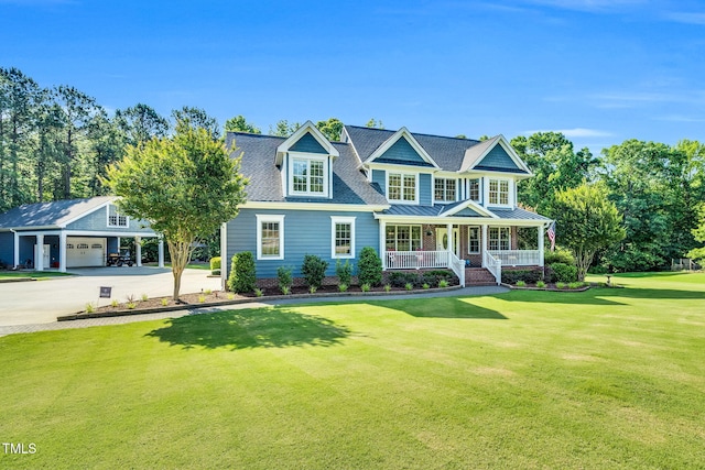 227 Paraggi Ct, Clayton, NC 27527 - shingle-style home featuring covered porch, driveway, a front lawn, a garage, and a standing seam roof