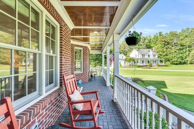 227 Paraggi Ct, Clayton, NC 27527 - porch featuring a lawn