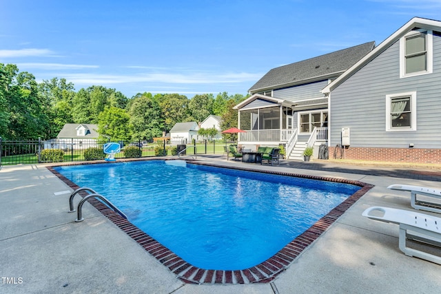 227 Paraggi Ct, Clayton, NC 27527 - view of pool with a sunroom and a patio area