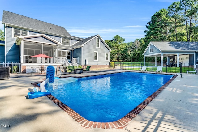 227 Paraggi Ct, Clayton, NC 27527 - view of pool featuring a sunroom and a patio area