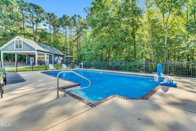 227 Paraggi Ct, Clayton, NC 27527 - view of pool featuring a patio and a wooded view