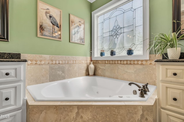 227 Paraggi Ct, Clayton, NC 27527 - full bathroom with vanity, a jetted tub, and wainscoting