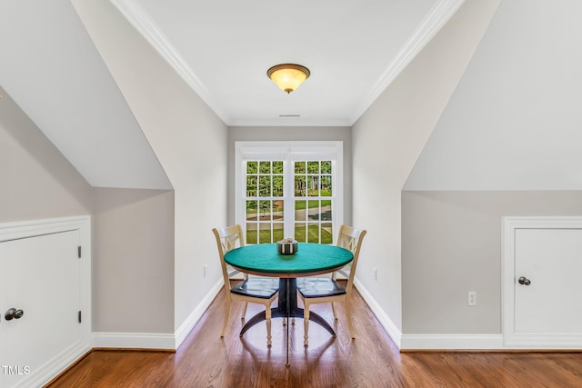 227 Paraggi Ct, Clayton, NC 27527 - dining area featuring wood finished floors, crown molding, and baseboards