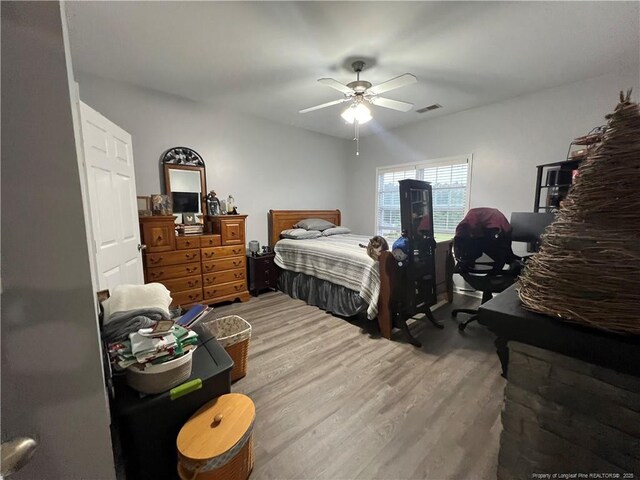 621 Marshtree Ln Unit 303, Fayetteville, NC 28314 - bedroom featuring wood finished floors and ceiling fan