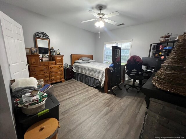 621 Marshtree Ln Unit 303, Fayetteville, NC 28314 - bedroom with wood finished floors and ceiling fan