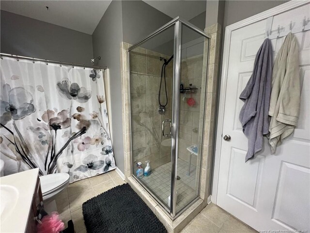 621 Marshtree Ln Unit 303, Fayetteville, NC 28314 - full bathroom featuring a stall shower, tile patterned flooring, toilet, and vanity