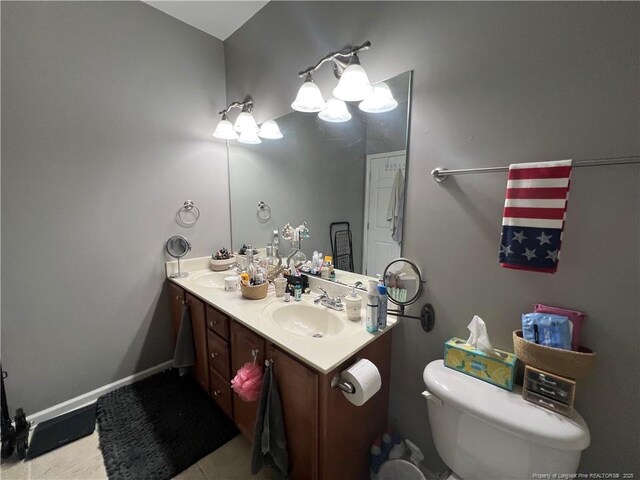 621 Marshtree Ln Unit 303, Fayetteville, NC 28314 - bathroom featuring double vanity, toilet, and tile patterned floors