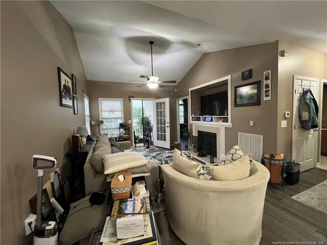 621 Marshtree Ln Unit 303, Fayetteville, NC 28314 - living room featuring dark wood-style flooring, lofted ceiling, a fireplace, and ceiling fan