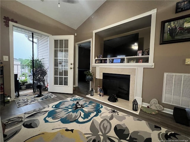 621 Marshtree Ln Unit 303, Fayetteville, NC 28314 - living room with wood finished floors, vaulted ceiling, and a high end fireplace