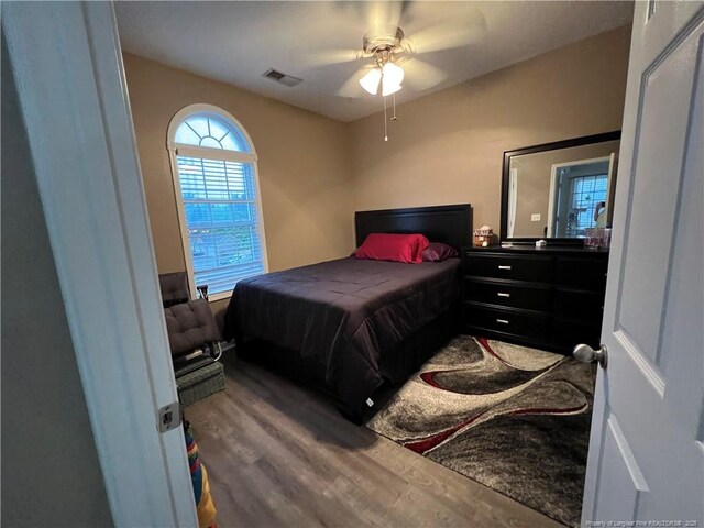 621 Marshtree Ln Unit 303, Fayetteville, NC 28314 - bedroom with wood finished floors and ceiling fan