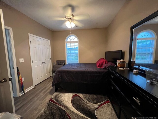 621 Marshtree Ln Unit 303, Fayetteville, NC 28314 - bedroom with dark wood finished floors, baseboards, and a ceiling fan