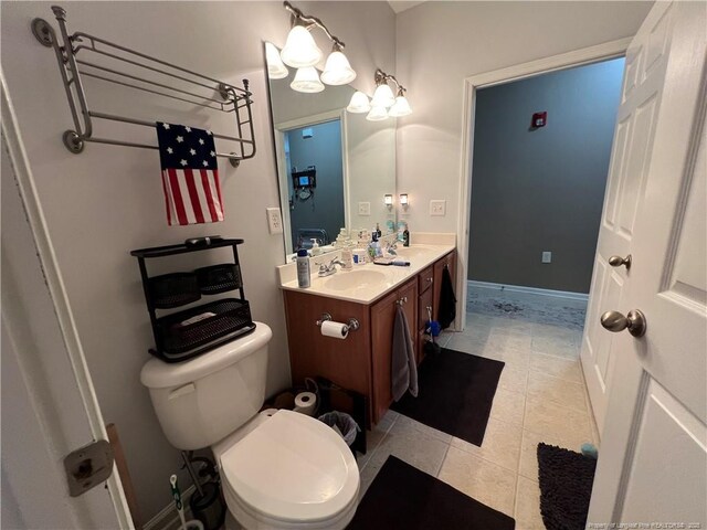 621 Marshtree Ln Unit 303, Fayetteville, NC 28314 - bathroom featuring double vanity, toilet, and tile patterned flooring