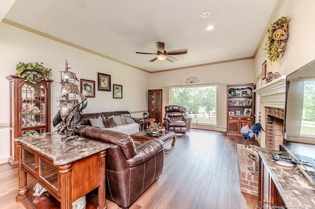 259 Golf Dr, Sanford, NC 27332 - living area with ceiling fan, plenty of natural light, light wood-style floors, crown molding, and a fireplace