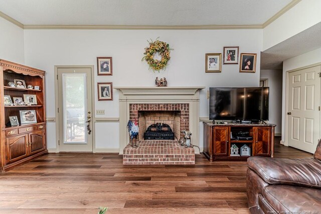 259 Golf Dr, Sanford, NC 27332 - living room with ornamental molding, wood finished floors, and a fireplace