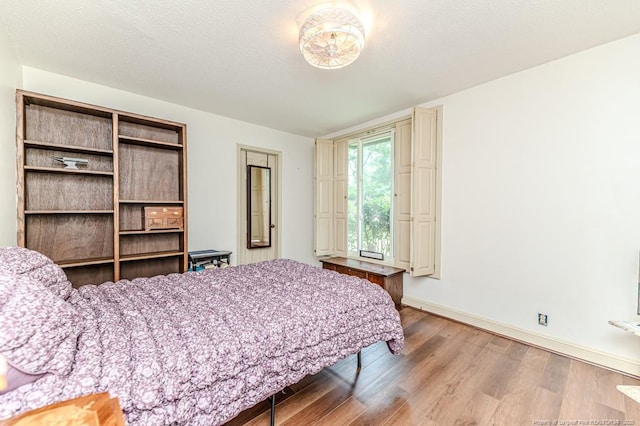 259 Golf Dr, Sanford, NC 27332 - bedroom featuring wood finished floors and baseboards