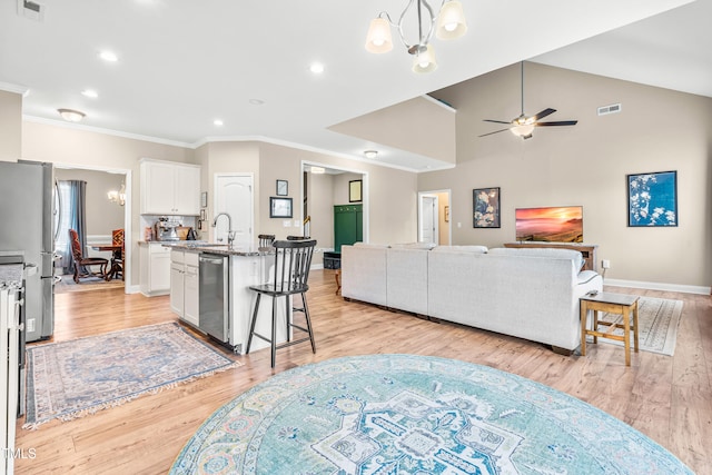 137 Clydes Point Way, Wendell, NC 27591 - living area with a chandelier, ornamental molding, ceiling fan, recessed lighting, and light wood-style floors