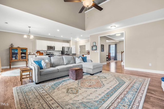 137 Clydes Point Way, Wendell, NC 27591 - living room with ceiling fan, ornamental molding, light wood-type flooring, baseboards, and recessed lighting