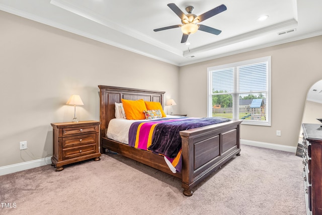 137 Clydes Point Way, Wendell, NC 27591 - bedroom featuring a tray ceiling, light colored carpet, crown molding, baseboards, and ceiling fan