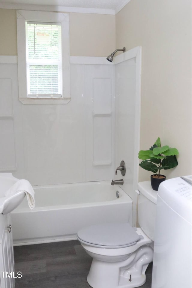 102 E Nash St, Elm City, NC 27822 - full bath with toilet, shower / bath combination, wood finished floors, vanity, and ornamental molding