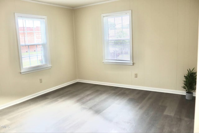 102 E Nash St, Elm City, NC 27822 - spare room with dark wood-style floors, ornamental molding, plenty of natural light, and baseboards