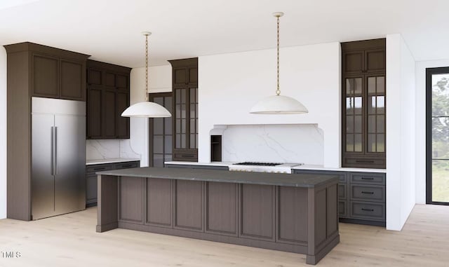 1808 Stream Manor Ct, Wake Forest, NC 27587 - kitchen with stainless steel built in fridge, a kitchen island, backsplash, light wood-style floors, and hanging light fixtures
