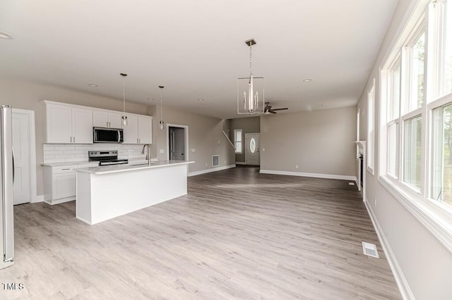 117 Knight Rd, Broadway, NC 27505 - kitchen with appliances with stainless steel finishes, ceiling fan, a sink, baseboards, and recessed lighting