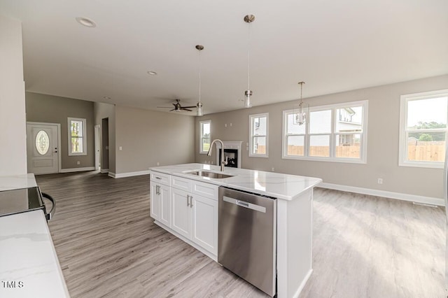 117 Knight Rd, Broadway, NC 27505 - kitchen featuring dishwasher, open floor plan, a sink, a fireplace, and ceiling fan
