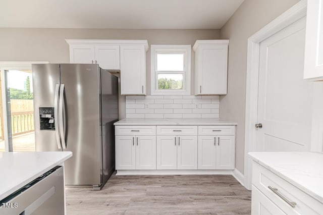 117 Knight Rd, Broadway, NC 27505 - kitchen with stainless steel fridge with ice dispenser, white cabinetry, and healthy amount of natural light