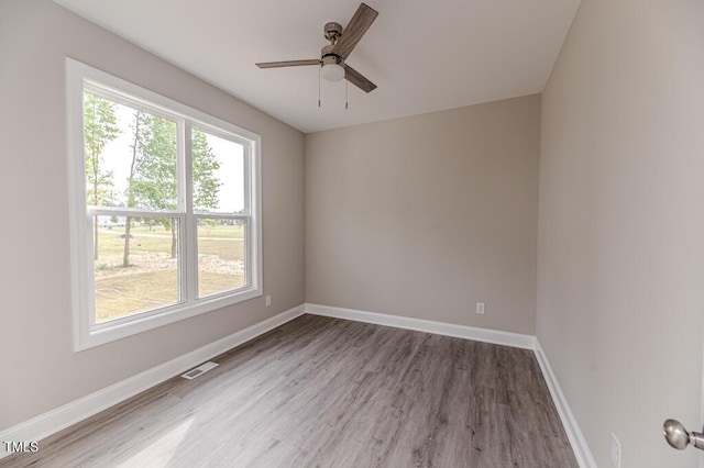 117 Knight Rd, Broadway, NC 27505 - empty room with healthy amount of natural light, wood finished floors, and baseboards
