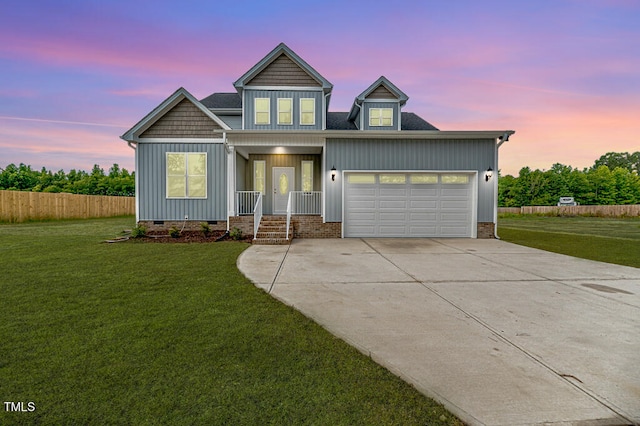 117 Knight Rd, Broadway, NC 27505 - view of front facade with crawl space, a porch, concrete driveway, an attached garage, and board and batten siding