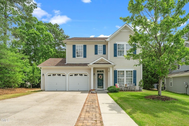 648 Long Melford Dr, Rolesville, NC 27571 - traditional-style house featuring driveway, a front lawn, and a shingled roof