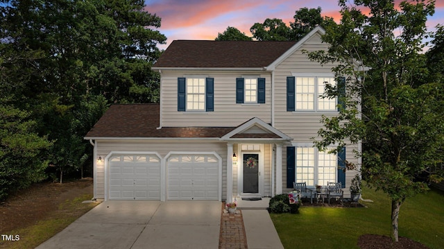 648 Long Melford Dr, Rolesville, NC 27571 - view of front of home featuring driveway, a lawn, roof with shingles, and an attached garage