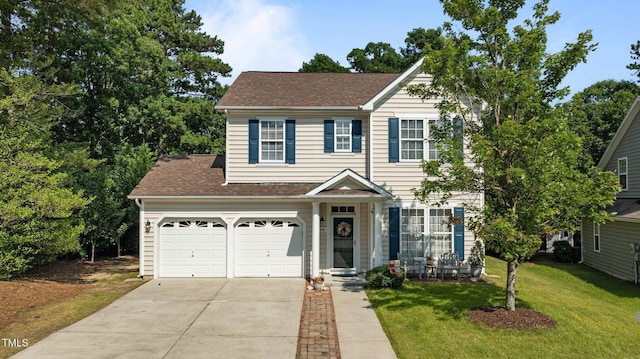 648 Long Melford Dr, Rolesville, NC 27571 - view of front facade featuring concrete driveway, a front lawn, and roof with shingles