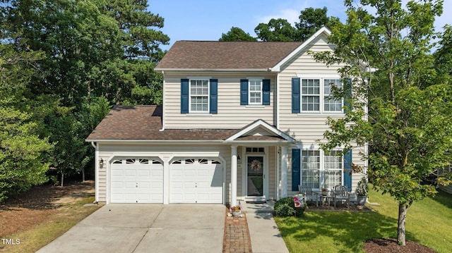648 Long Melford Dr, Rolesville, NC 27571 - traditional-style home featuring driveway, a front yard, a garage, and a shingled roof