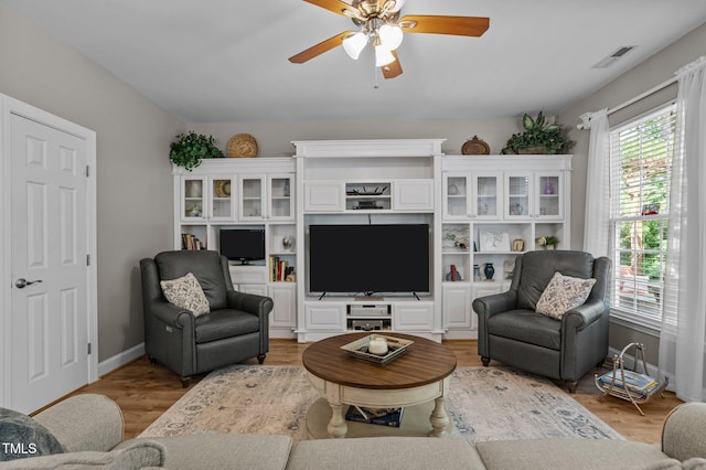 648 Long Melford Dr, Rolesville, NC 27571 - living area with a ceiling fan, baseboards, and light wood finished floors
