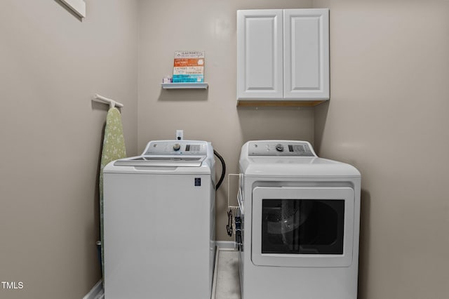 648 Long Melford Dr, Rolesville, NC 27571 - washroom featuring cabinet space and independent washer and dryer