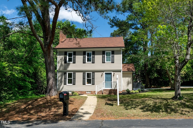 3317 E Jameson Rd, Raleigh, NC 27604 - colonial home with a chimney and a front lawn