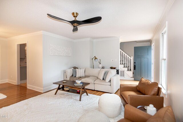 3317 E Jameson Rd, Raleigh, NC 27604 - living area featuring stairway, ornamental molding, wood finished floors, and a ceiling fan