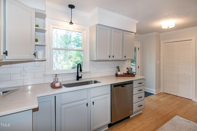 3317 E Jameson Rd, Raleigh, NC 27604 - kitchen with dishwasher, tasteful backsplash, light countertops, light wood finished floors, and open shelves